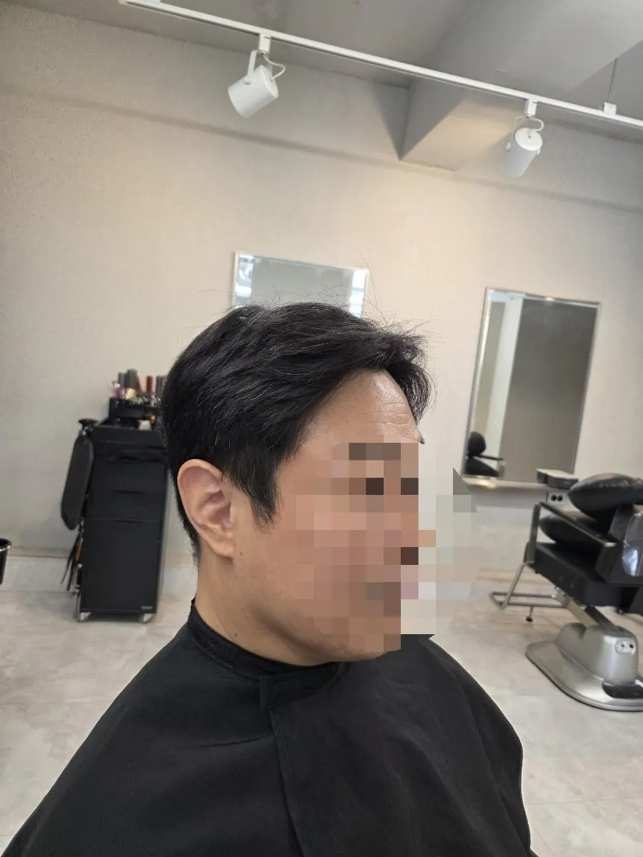 Shaggy, grown-out men's hair before the service