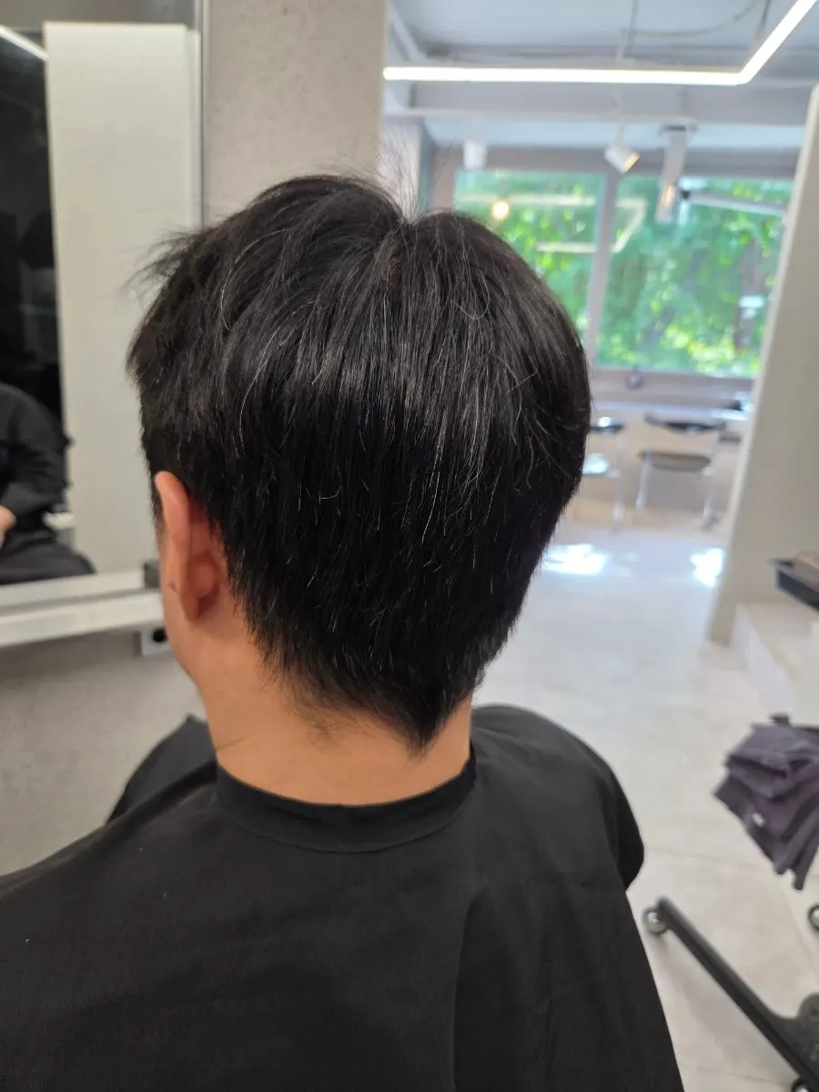 Before shot showing the sides sticking up before the down perm