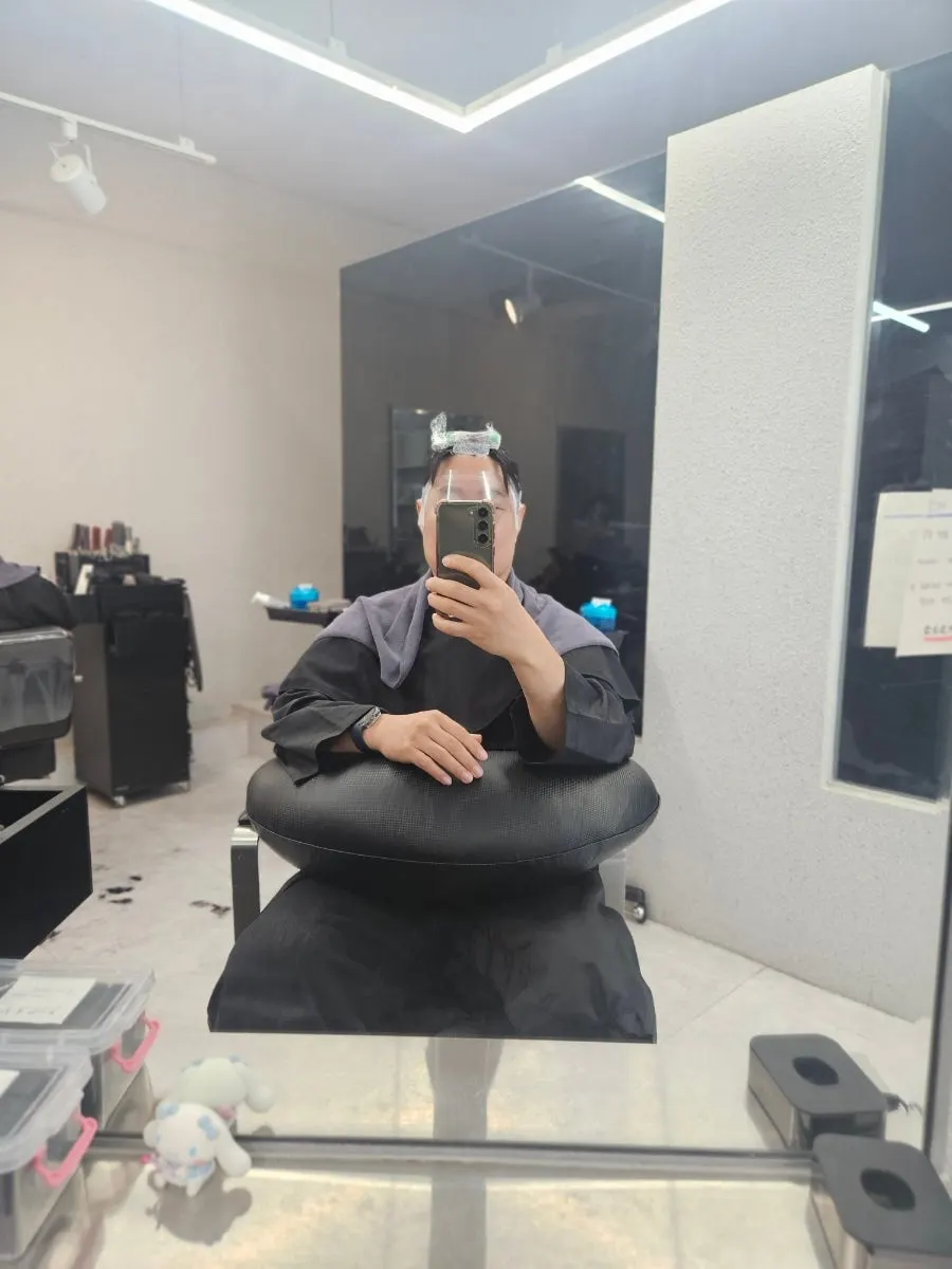 Down perm papers wrapped to fit the head shape