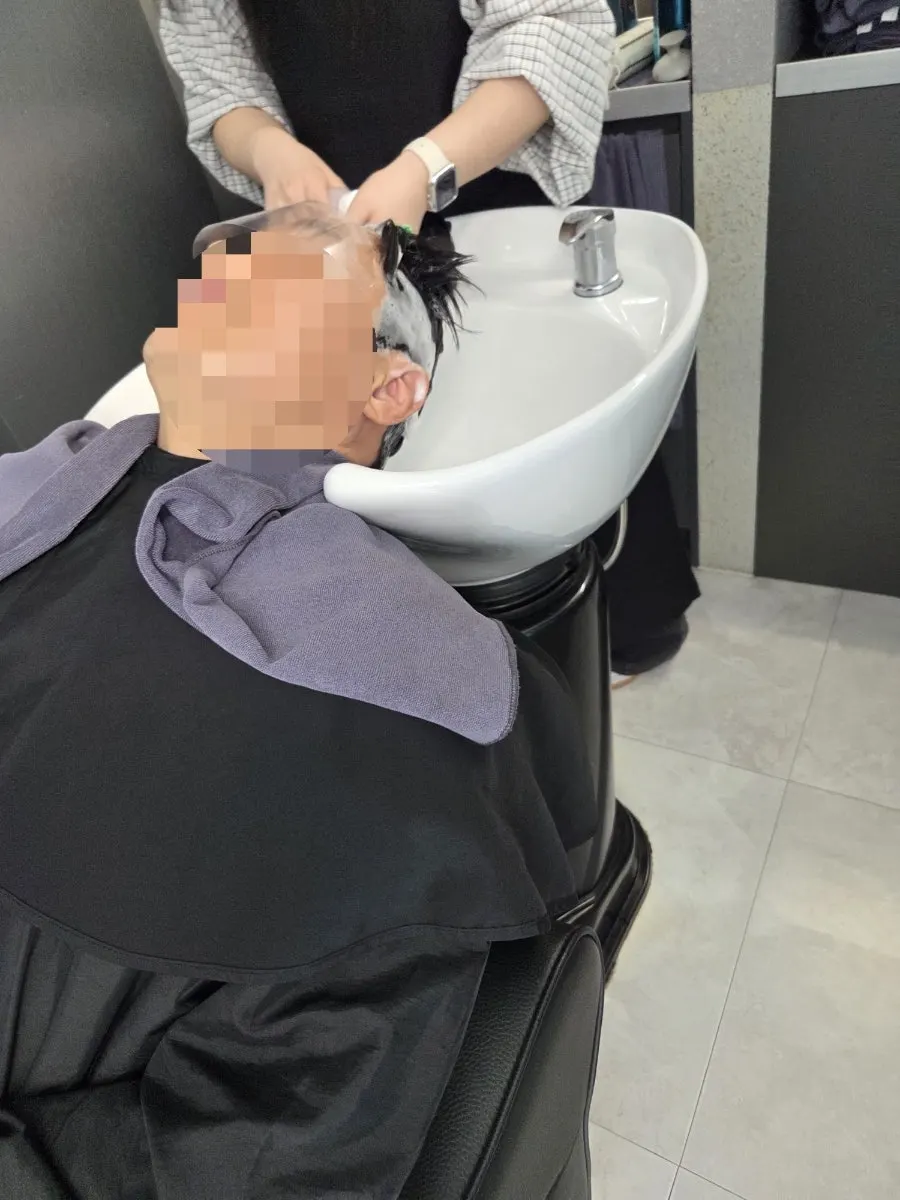 Air gun blowing away loose hair