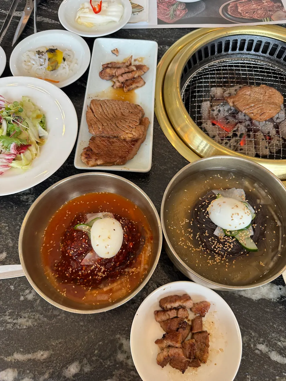 Table spread of ordered marinated pork ribs at Ihwajeong Galbi Myeongga