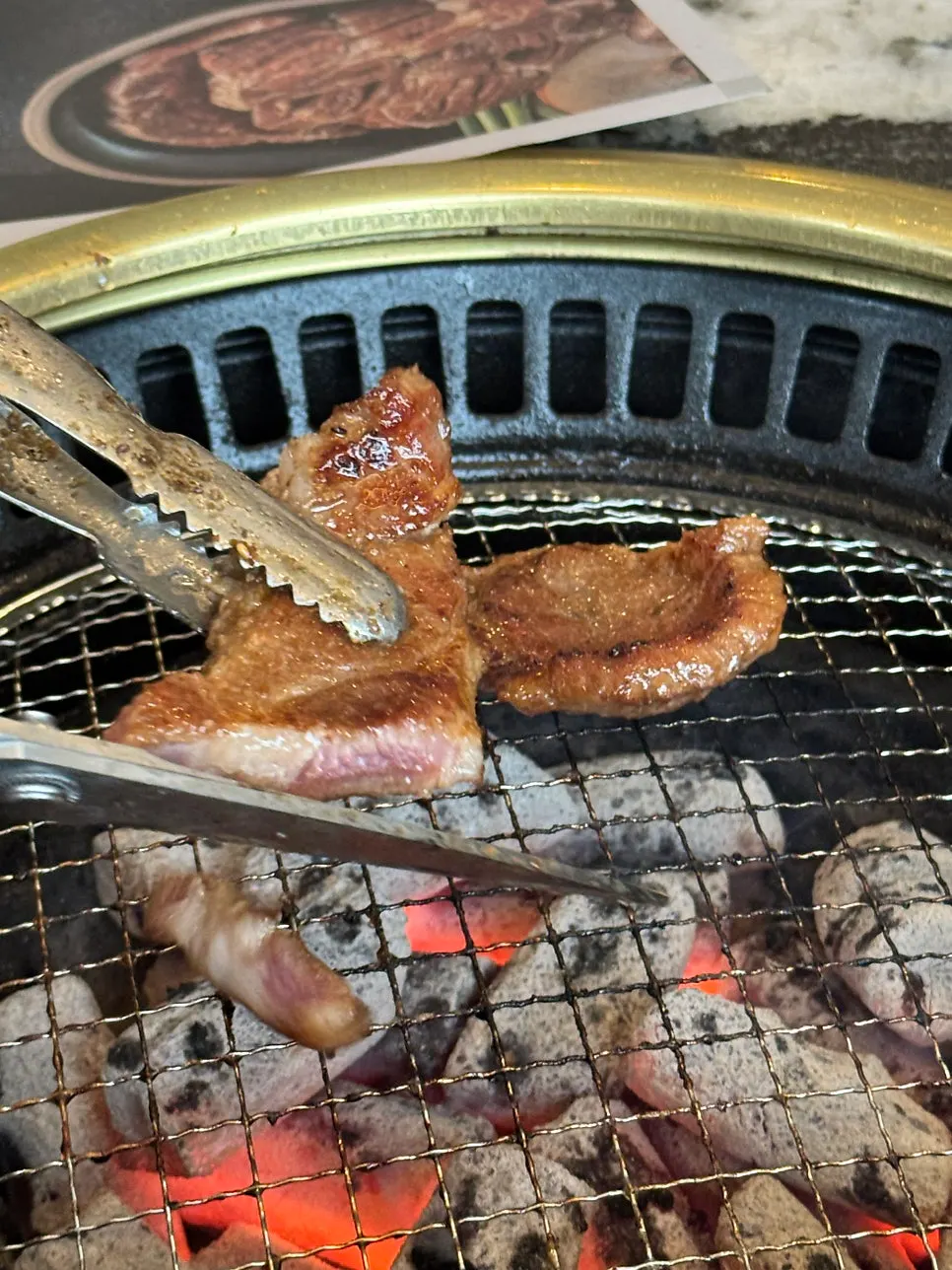 The remaining half of the pork ribs being grilled