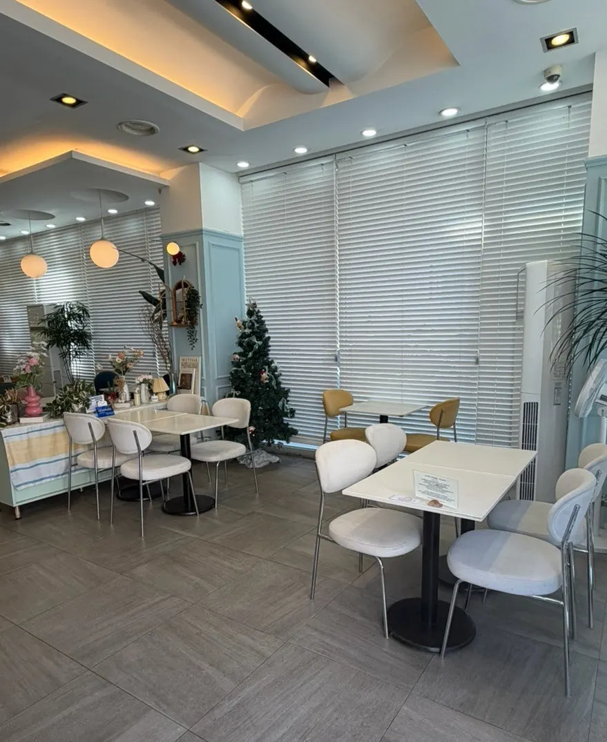 Interior of Eight Years with plants placed around the space
