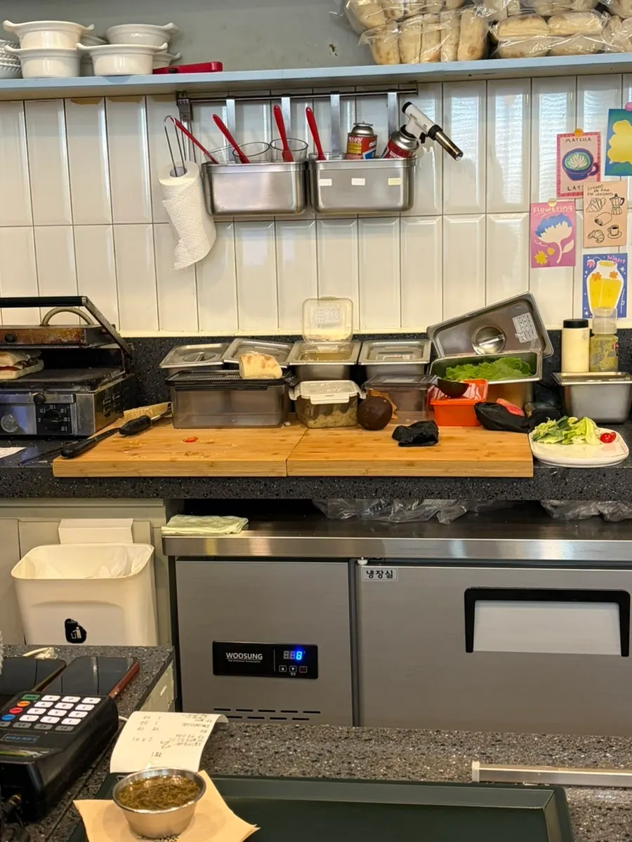 Seating area and menu signage at Eight Years