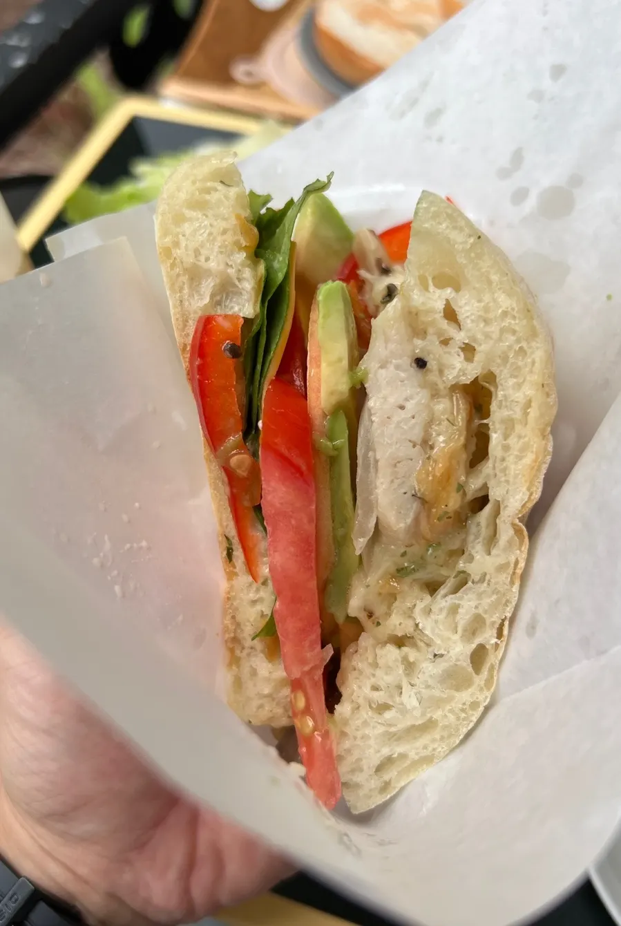 Ciabatta sandwich wrapped in wax paper