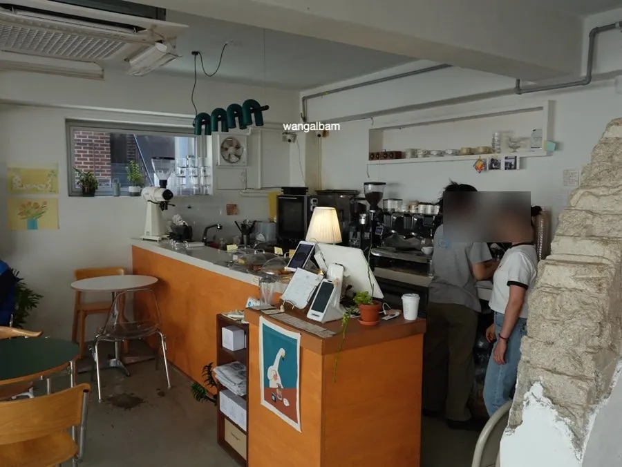 Full view of the café interior packed with customers