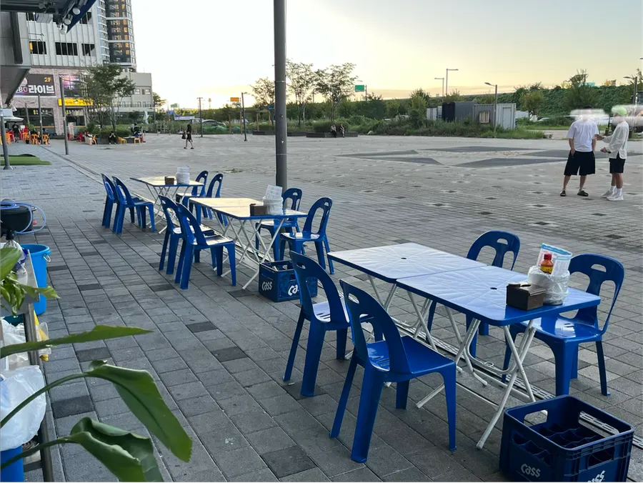 Outdoor tables set up in front of the store