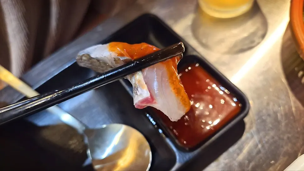 Table with sashimi and beer