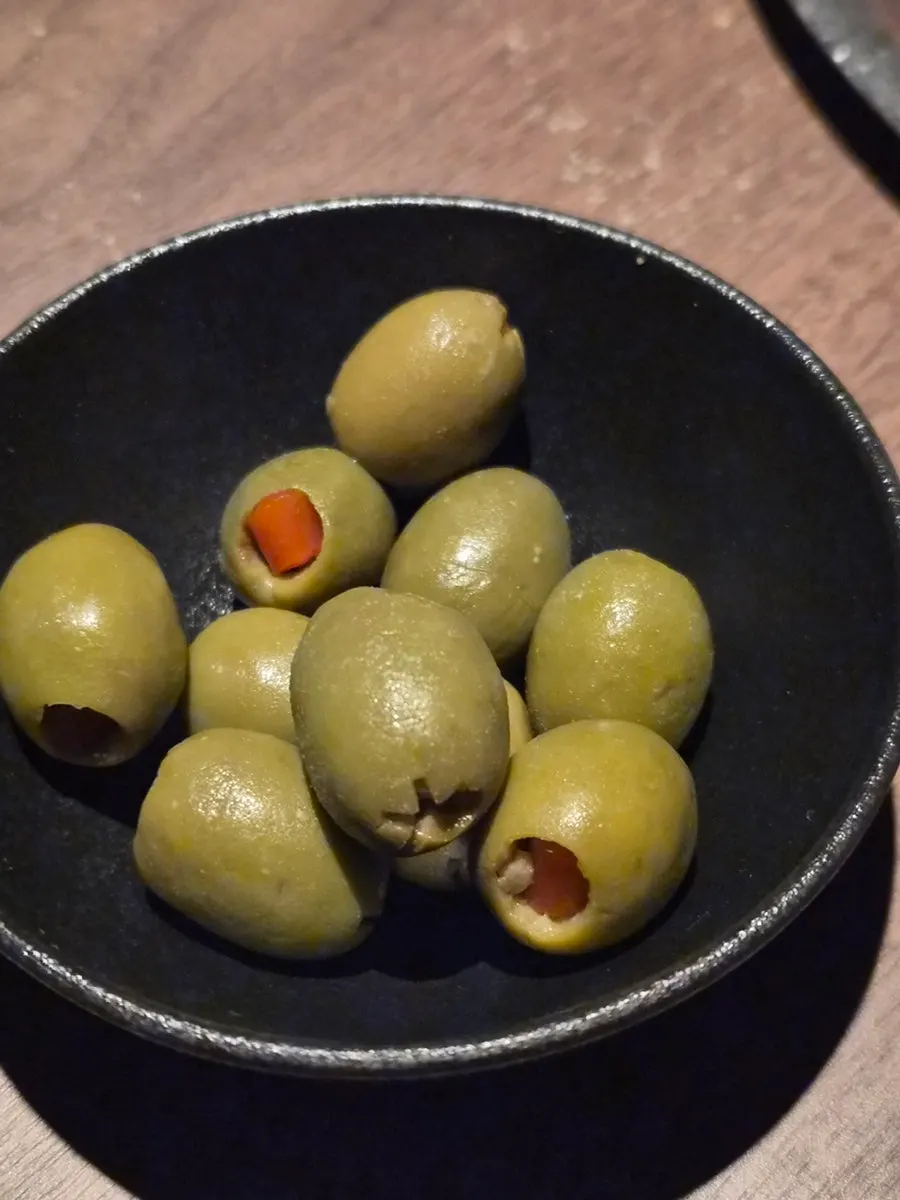A plate of olives served as a free extra