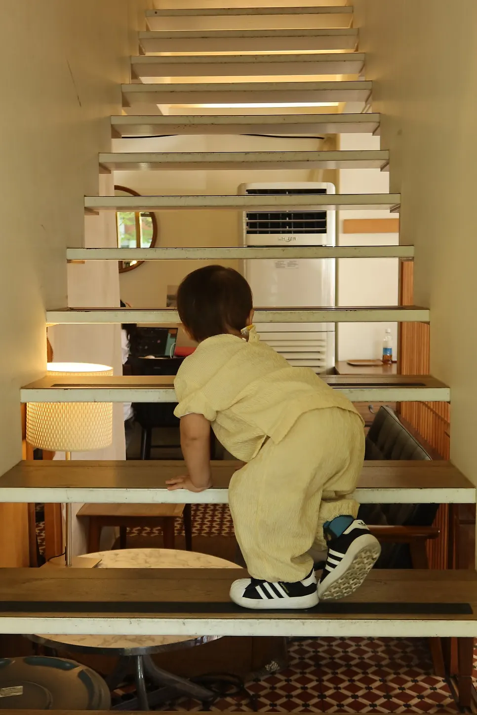 17-month-old baby playing on the stairs