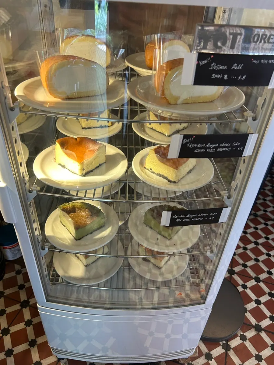 Two slices of plain and matcha Basque cheesecake