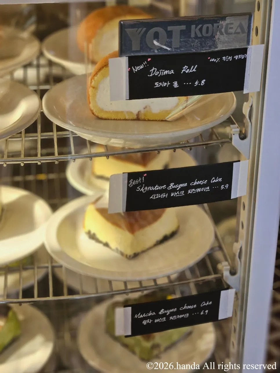 Baked goods and cakes displayed in the showcase