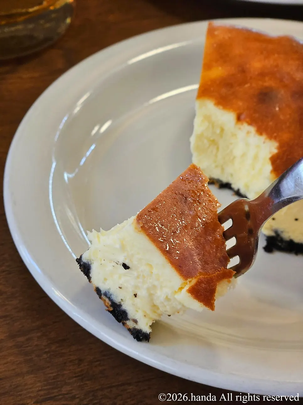 A slice of the signature Basque cheesecake