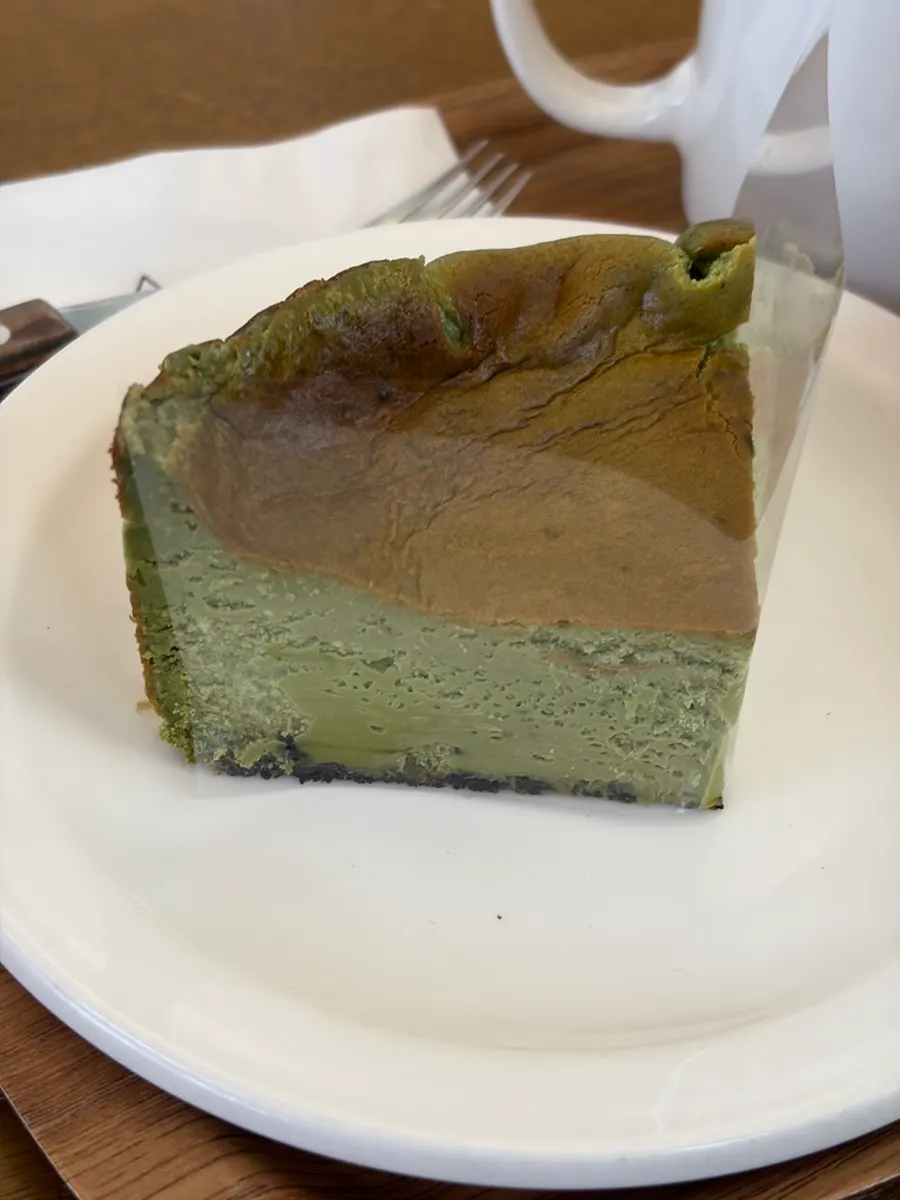 A dense, fudgy slice of matcha basque cheesecake
