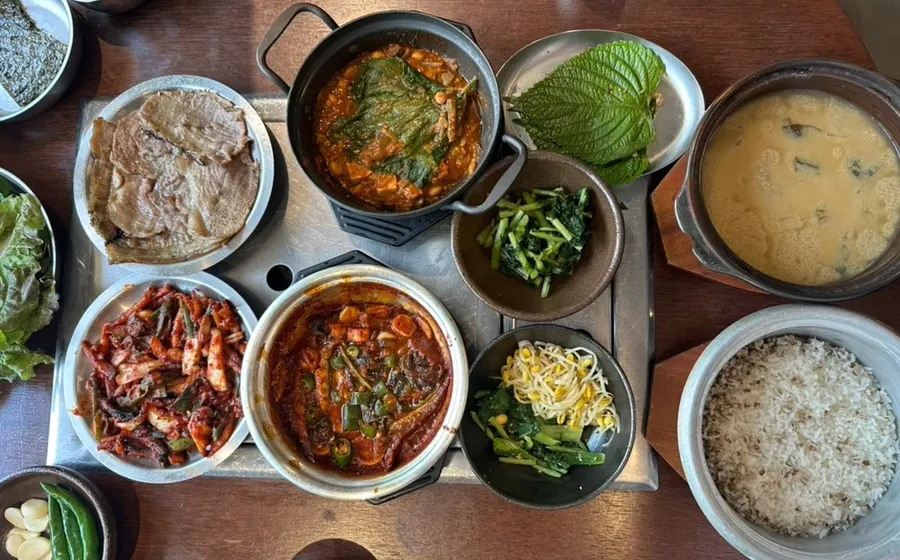 Wide shot of the table packed with the full set meal