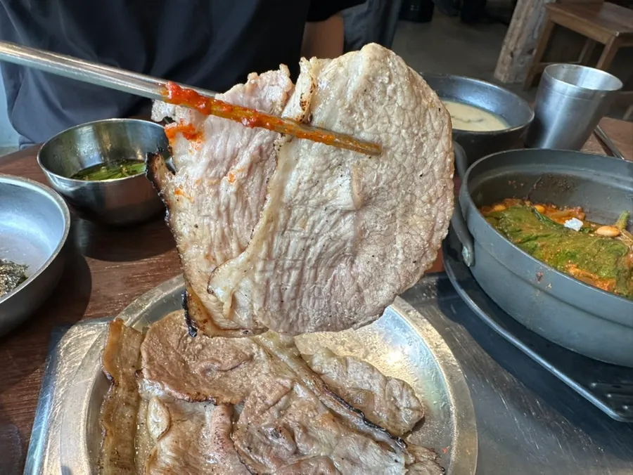 Thin layers of pork bulgogi stacked on a plate