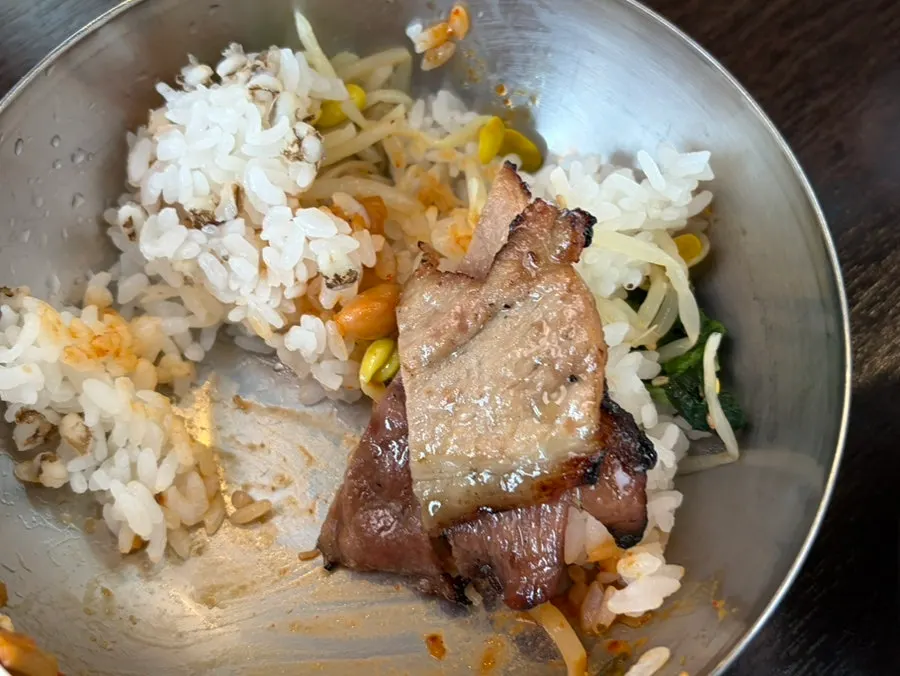 Charcoal bulgogi piled on top of bibimbap
