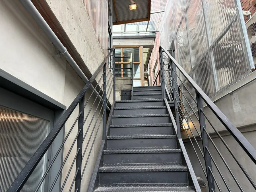 Outdoor staircase leading to the second floor