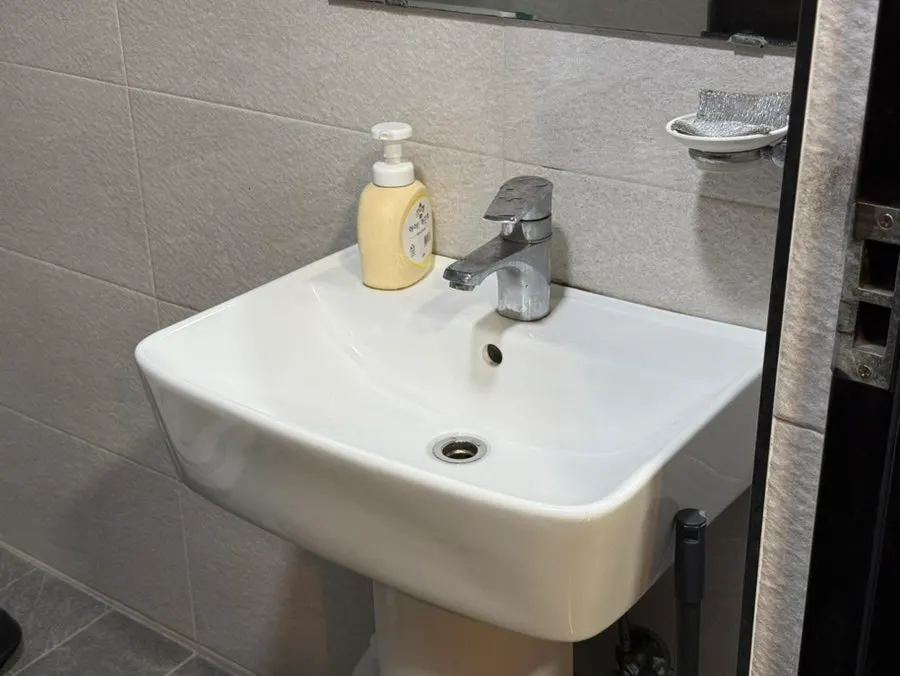 Interior of the shared restroom with separate men's and women's sections