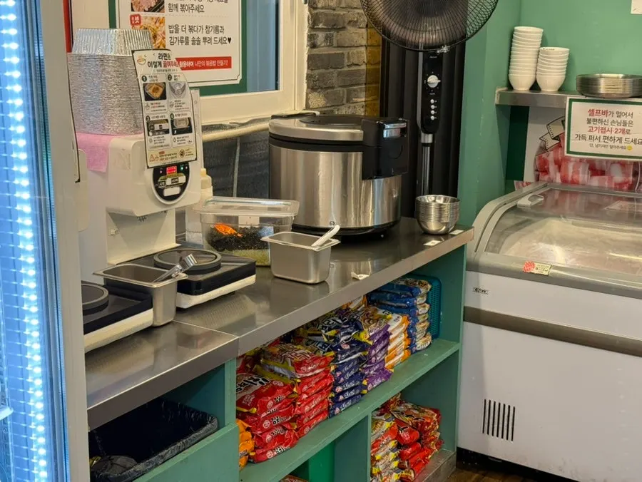 Self-serve fried rice and plain rice corner