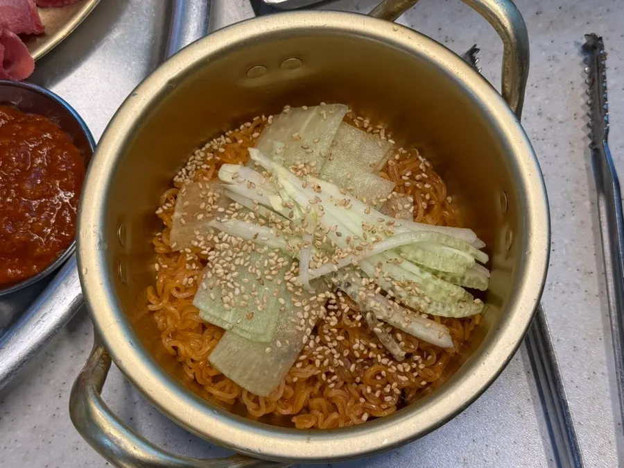 Separately ordered bibimmyeon paired with grilled meat