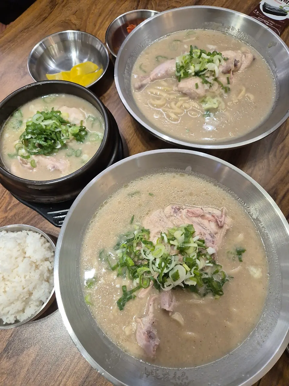 Table set with dak kalguksu and dak gomtang