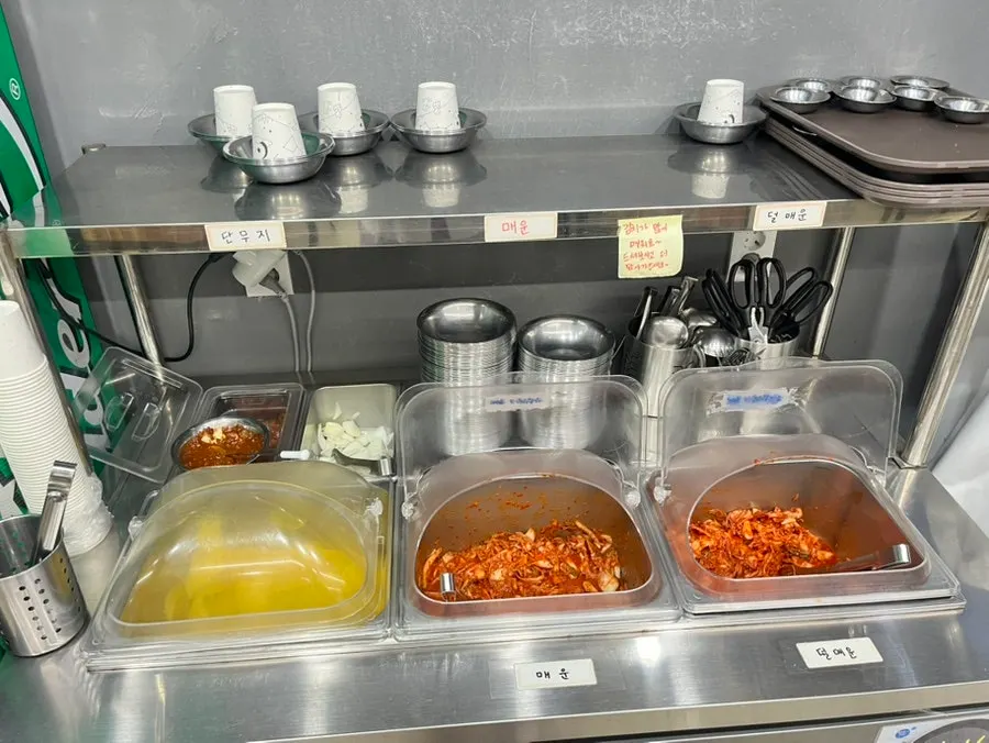 Self-serve bar with kimchi and pickled radish