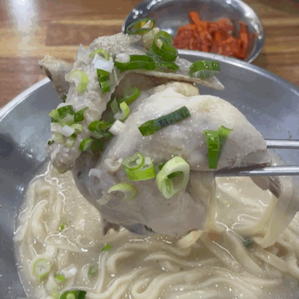 Thick, rich dak kalguksu broth