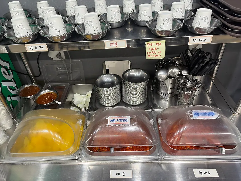 The self-serve corner with spicy and mild kimchi