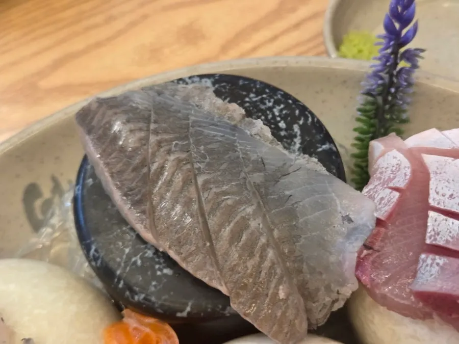 Sashimi dipped in wasabi and soy sauce