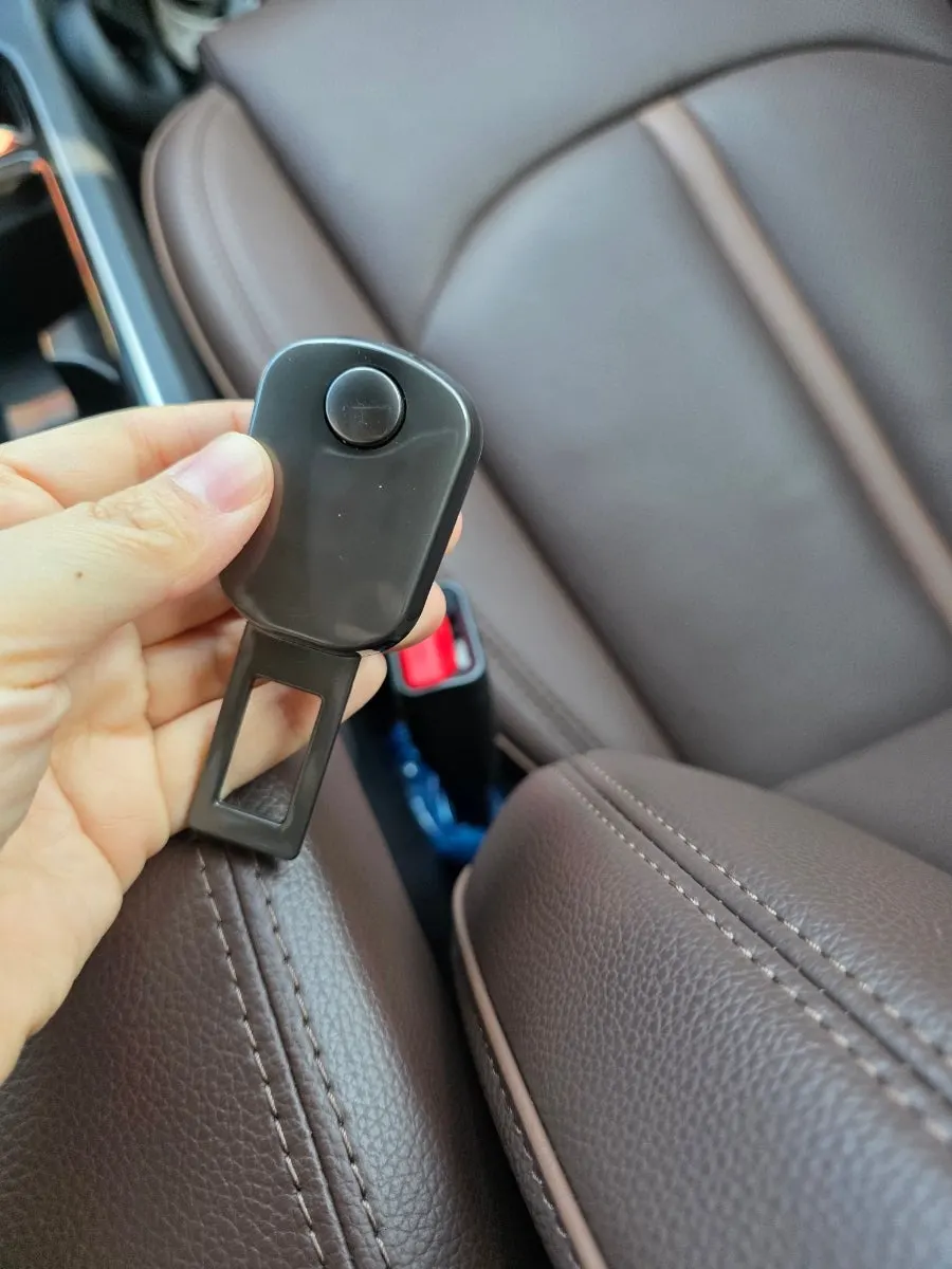 Dark-black car seat belt extender clip exterior