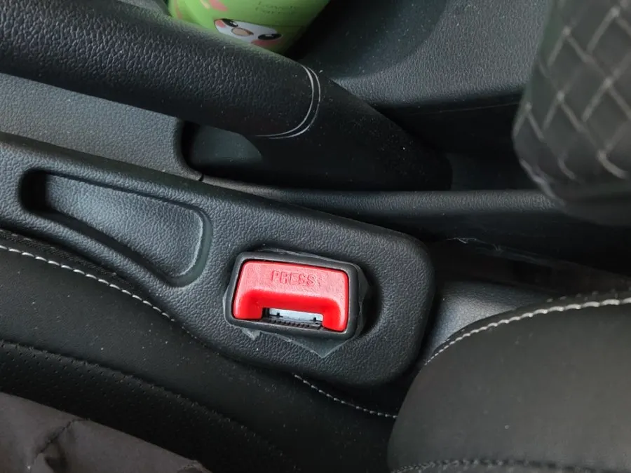 Seat belt extender clip fitted into a car buckle