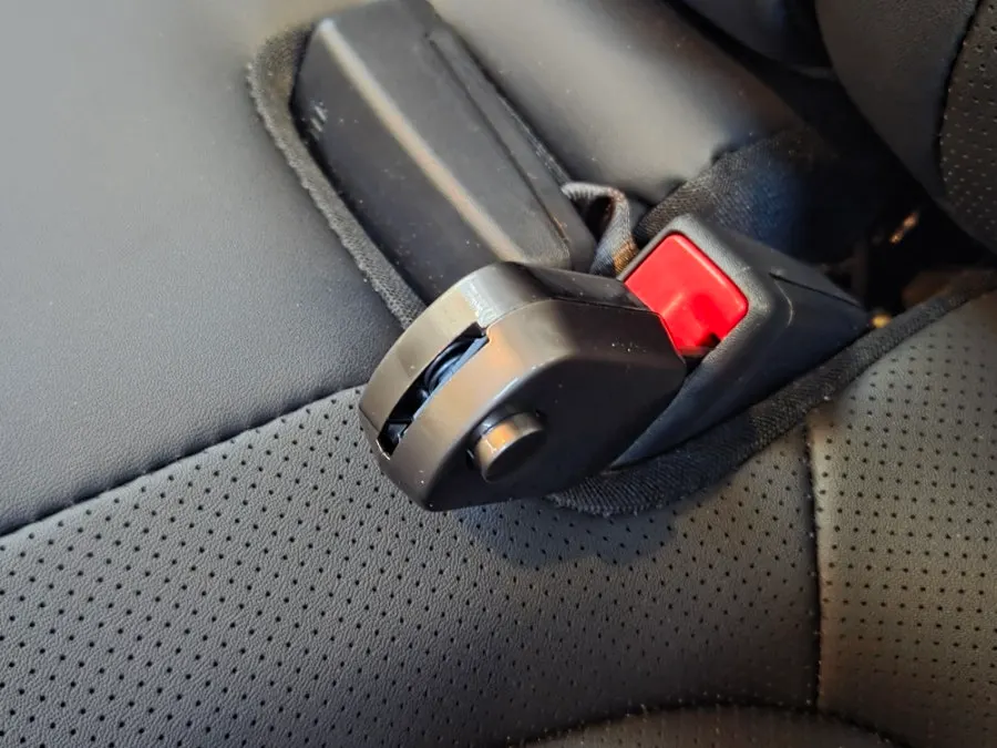 Rear-seat buckle area checked for extender clip use