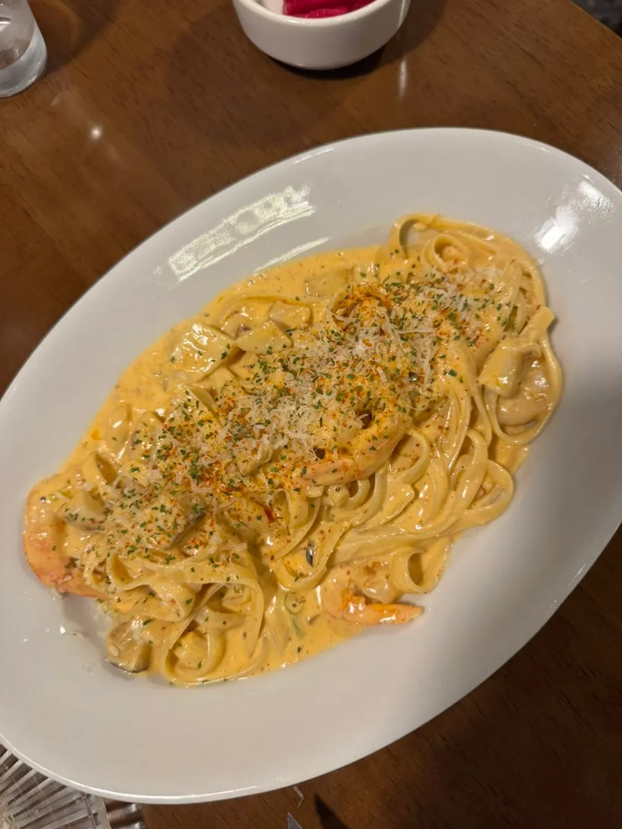 Toowoomba pasta topped with shrimp and king oyster mushrooms