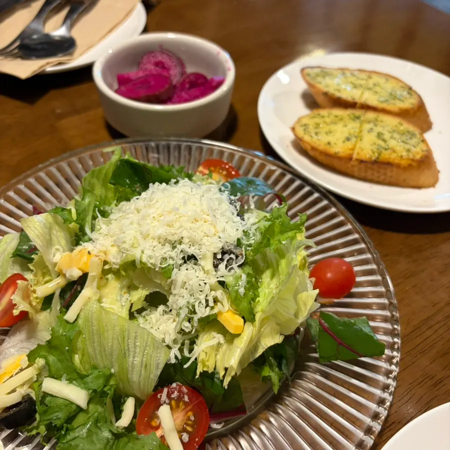 Table set with pre-meal bread and salad