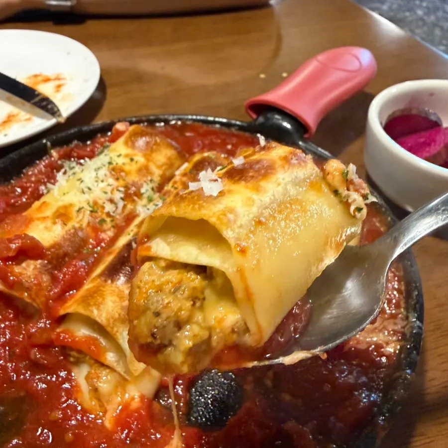 A slice of lasagna served on a plate