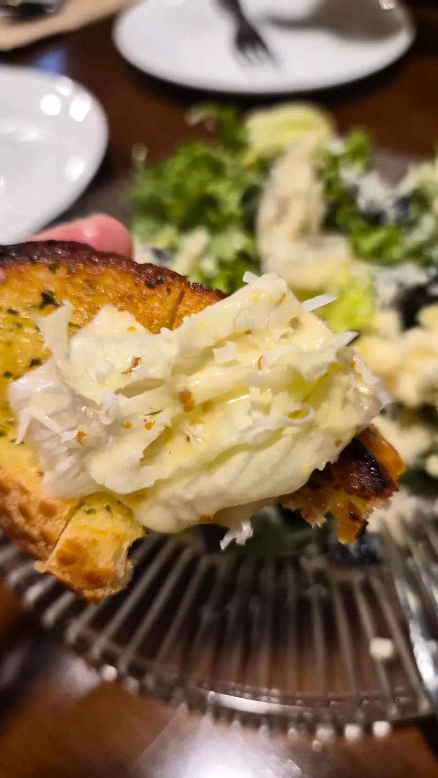 Salad placed on top of garlic bread