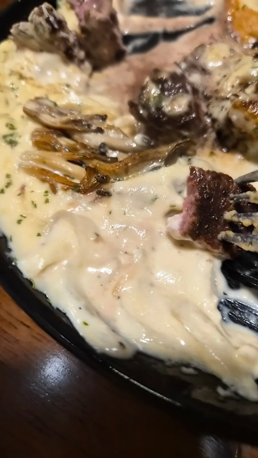 Plate of black tiger shrimp and mushroom cream tenderloin steak