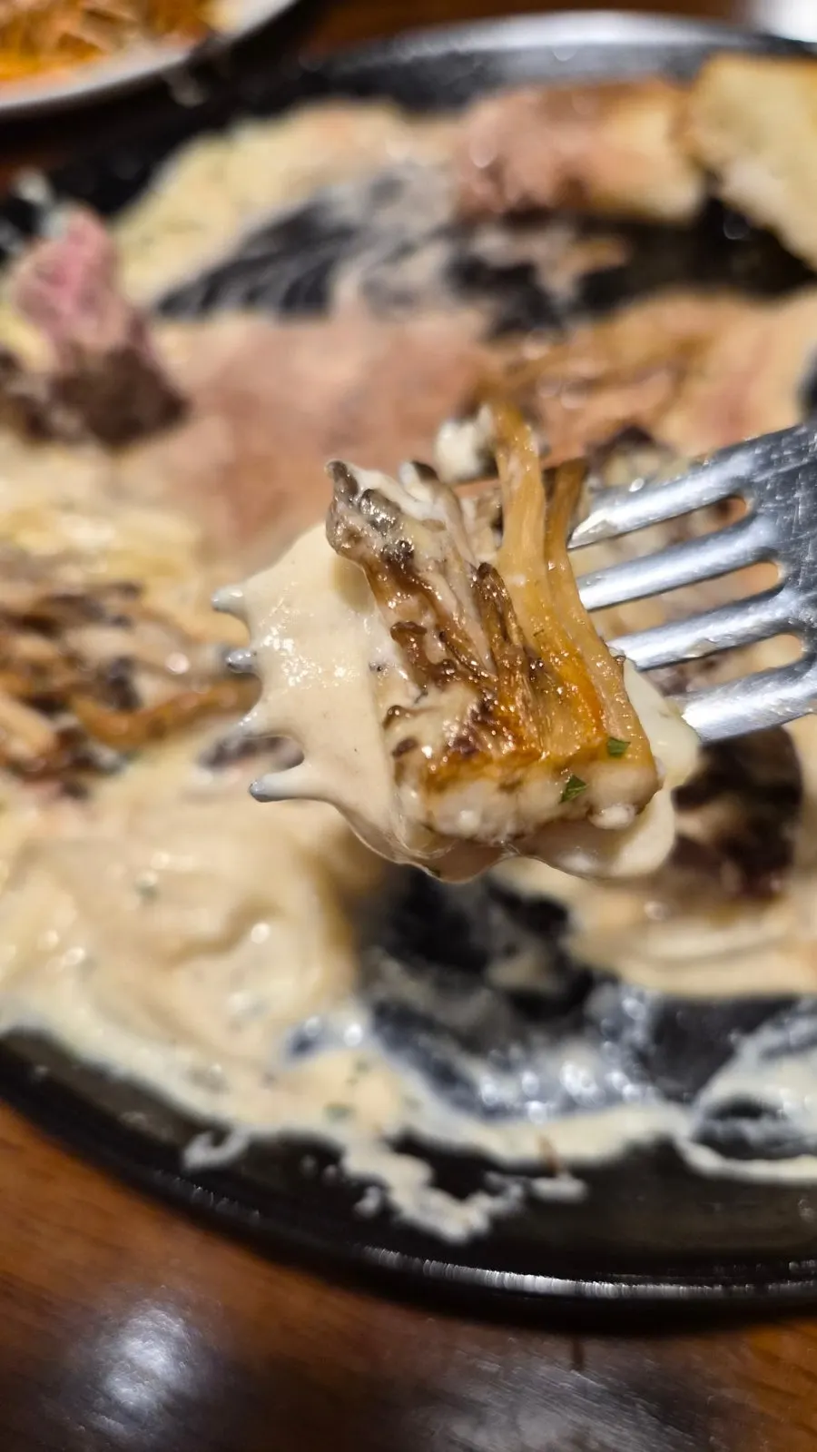 Close-up of cheese-topped black tiger shrimp