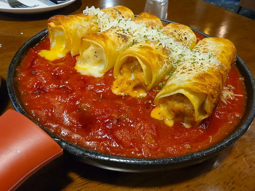 Half-and-half lasagna served on a plate