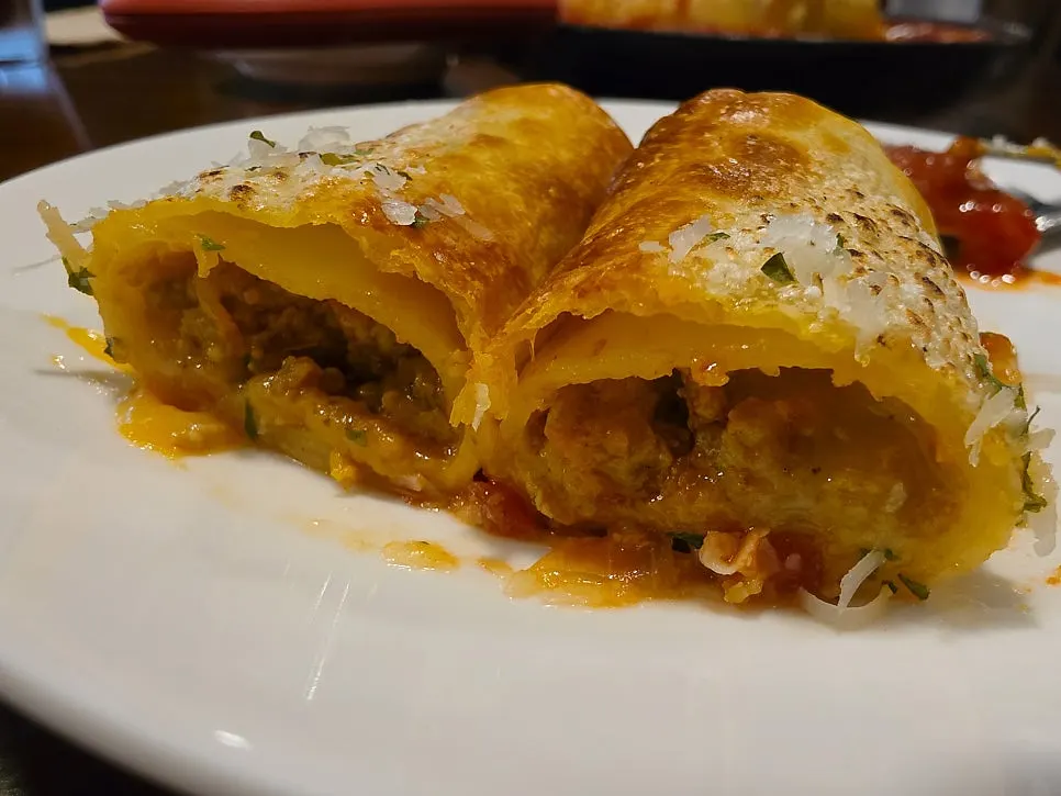 Close-up of lasagna with tomato sauce