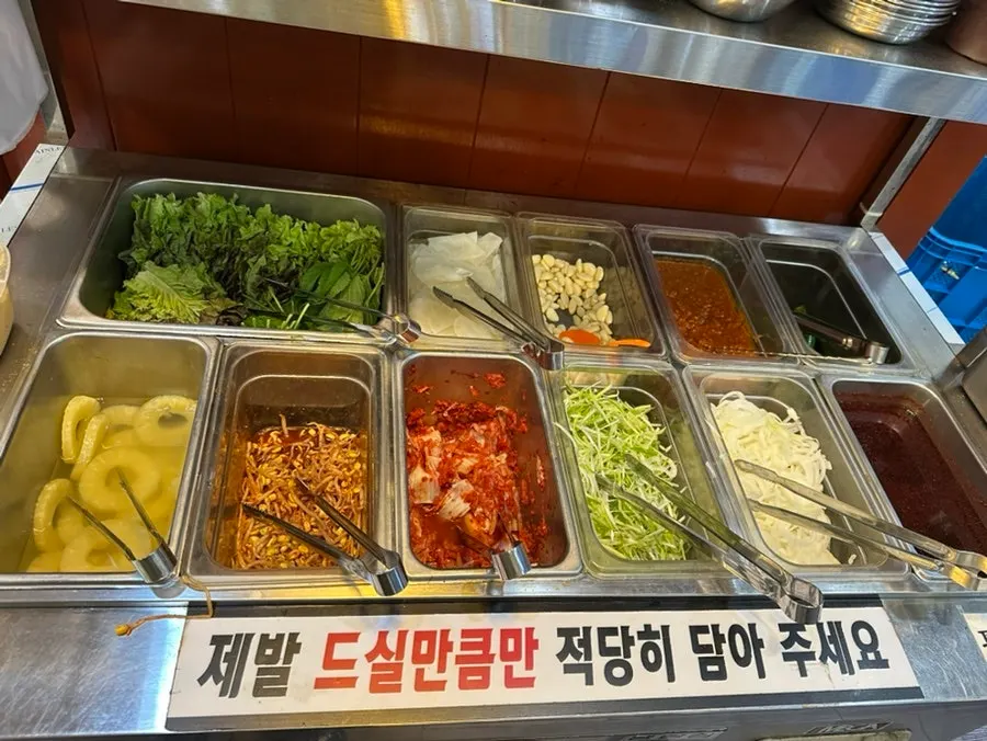 Kimchi and side dishes placed on the charcoal grill