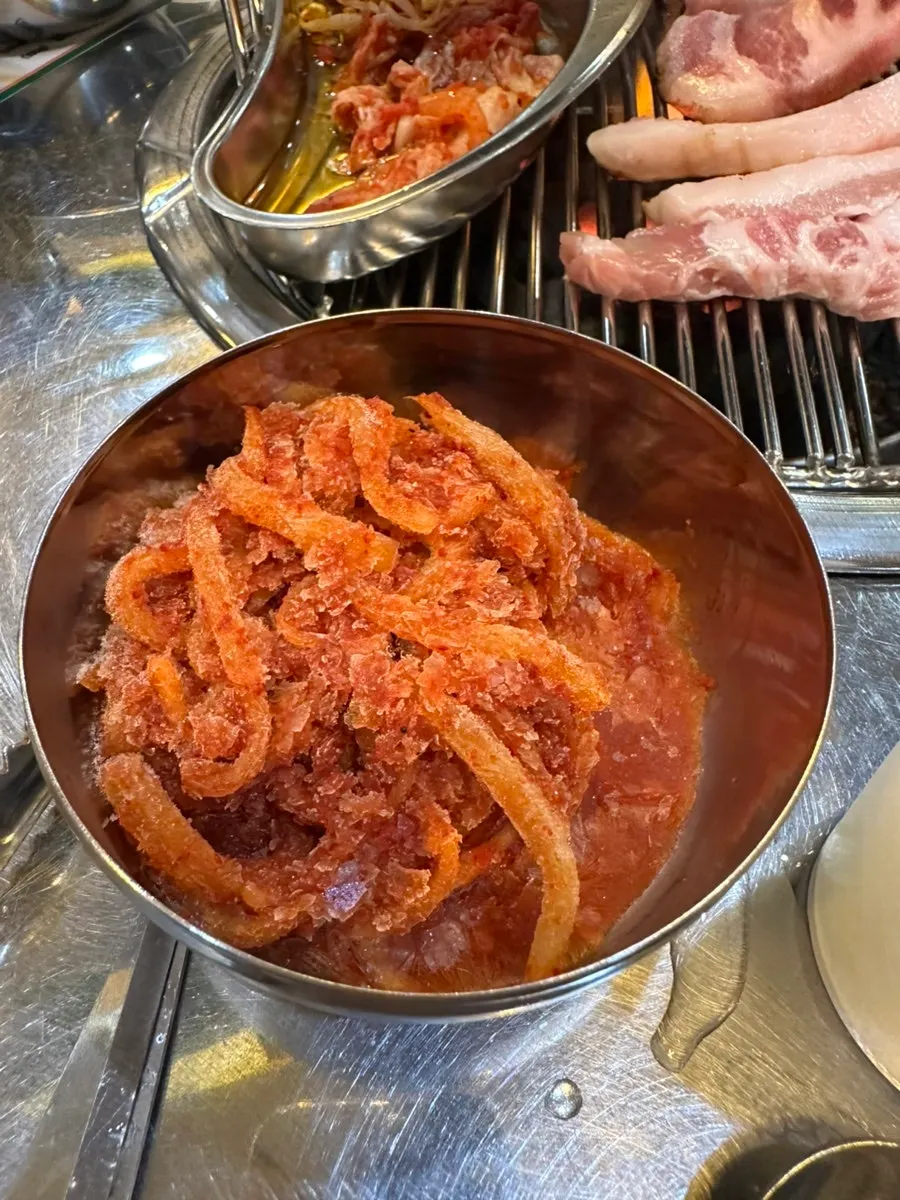 Pork belly and pork neck grilling on charcoal