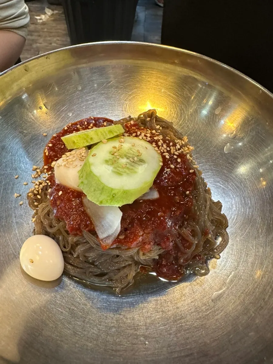 Grilled meat paired with frozen radish salad