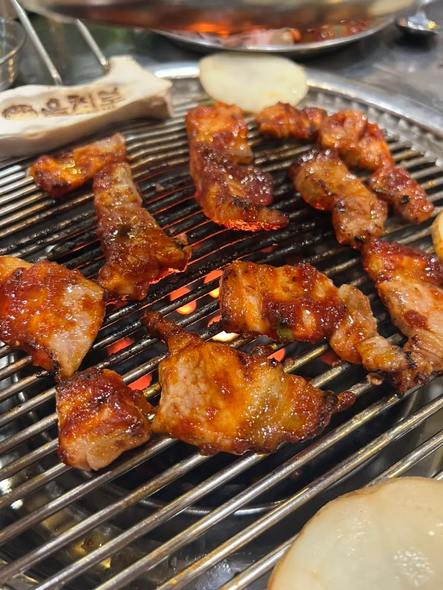 Pork belly getting its first grill on the charcoal