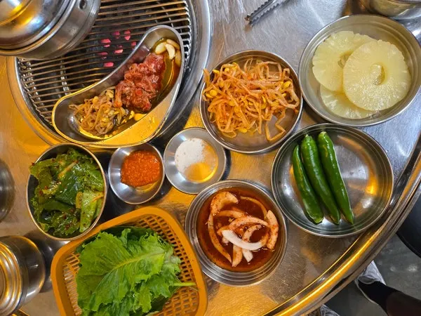 Self-serve bar with pickled onions, garlic, chili peppers, and pickled radish