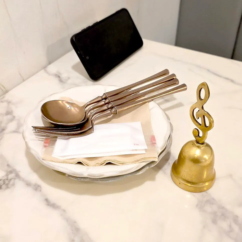 Basic table setting at Eulji Darak Dosan with personal tableware and a bell
