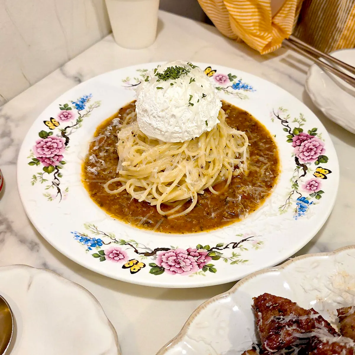 Darak Rose Pasta topped with cream