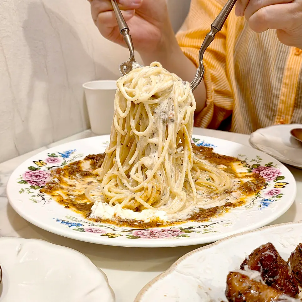 Rose pasta noodles tossed well with the meat sauce