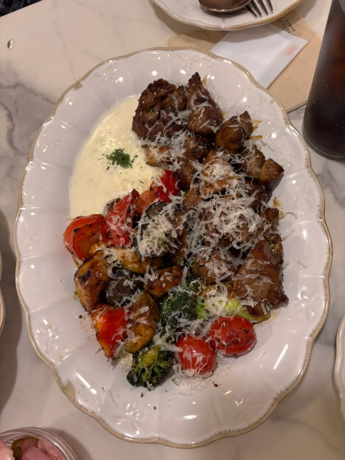Signature pork neck steak served with grilled vegetables